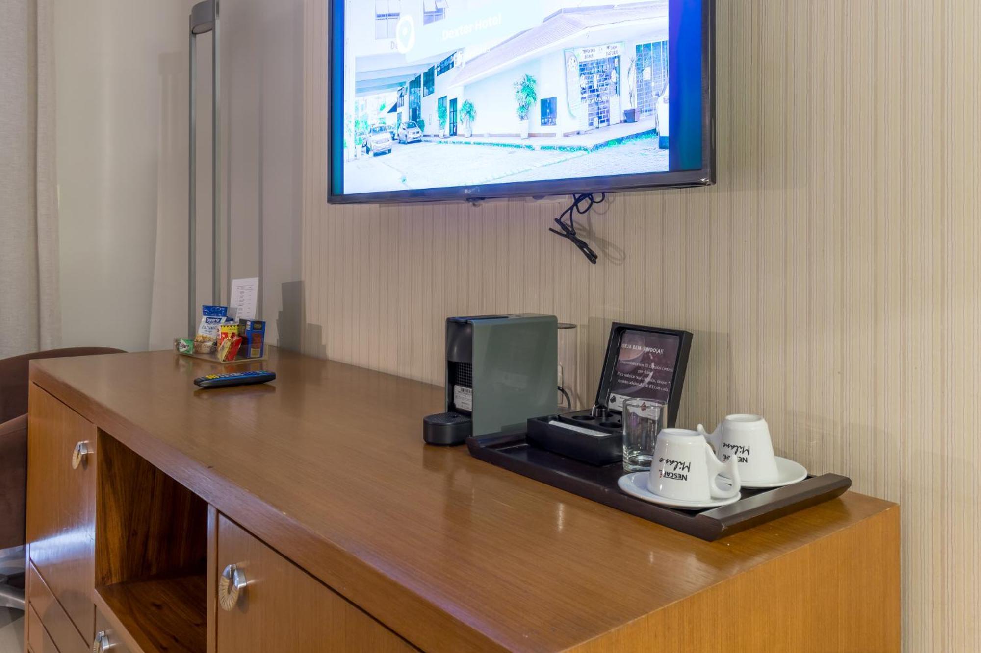 Parque Balneario Hotel Santos By Castelo Itaipava Room photo A Nespresso machine in a hotel room